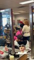 Woman confronts a beautician during hair salon argument