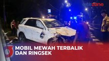 Sibuk Bermain Ponsel, Mobil Mewah Terbalik dan Ringsek