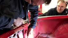 Dent pulling on a classic Lancia Sports Coupe
