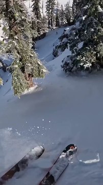 Skier Navigates Steep Cliff