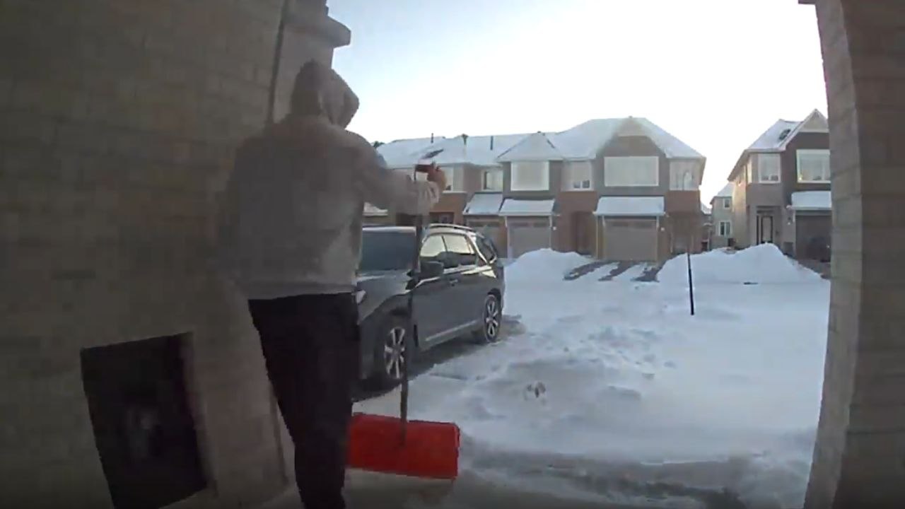 Man slips in the porch stairs trying to clear the snow away *Hilarious Fail*