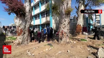 Filistin'de okul bahçesine defnedilen cesetler mezarlıklara taşınıyor