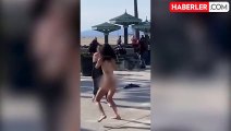 Los Angeles'ta bir kadın, plajda çıplak gezen kadına çivili sopa ile saldırdı