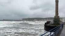 Waves crash over Douglas Promenade