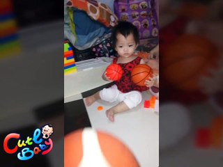 Little girl chasing balls