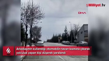 Otomobilin tavanından düşüp yaralandı