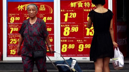 China sets 5% growth goal, toughens talk on Taiwan