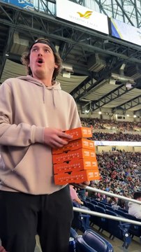 Guy Throws Free Pizza Into the Crowd At Detroit Monster Jam