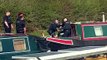 Police descend upon boat on Wheelton Canal to check for 'severed hand'.