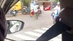 Man Directing Traffic Wears Water Jug in Indonesia