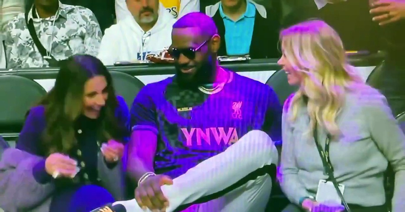LeBron James talks to Jeannie Buss during Lakers-Bucks game