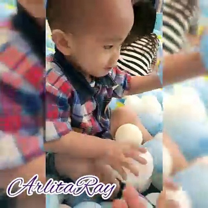 Playing in ball pit