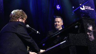 Sir Elton John gives piano auction a nudge at his Academy Awards’ viewing party