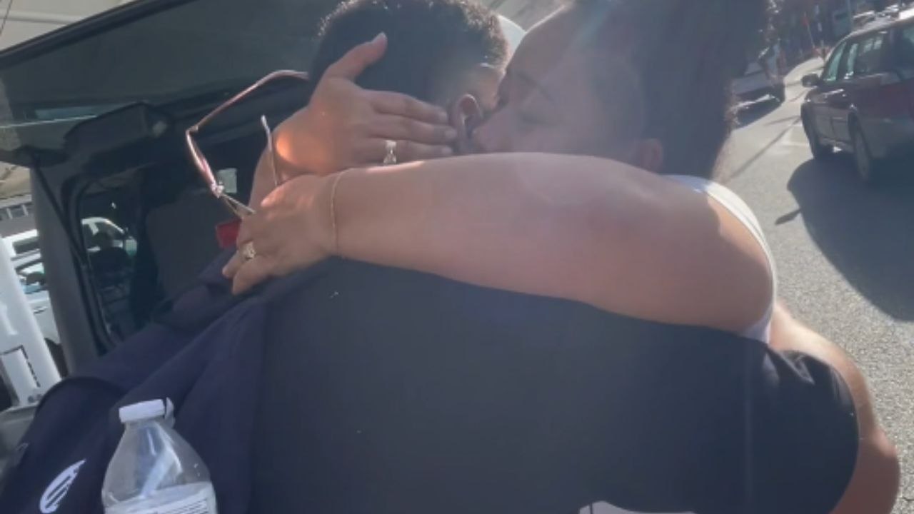 Man surprises partner's family, receives overflowing love in heartwarming reunion