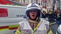 Reporter Richard Hunt speaks to a fire officer at the scene of a huge blaze in Havelock Street, Blackpool