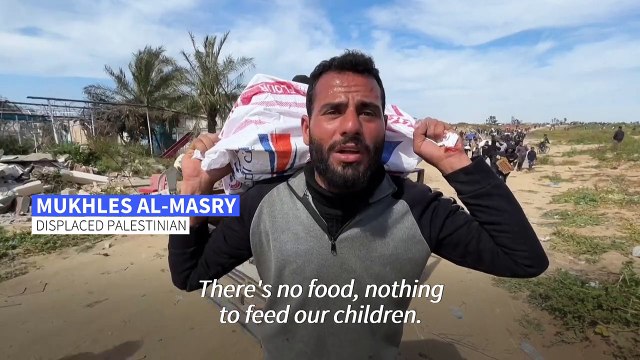 Palestinians rush for aid airdropped in the northern Gaza Strip