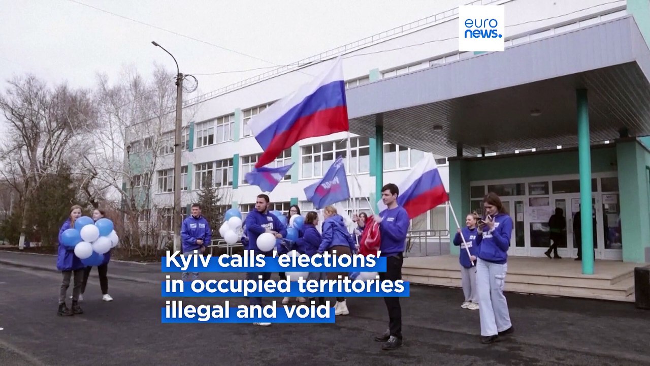 Soldiers continue their door-to-door campaign for votes in Mariupol