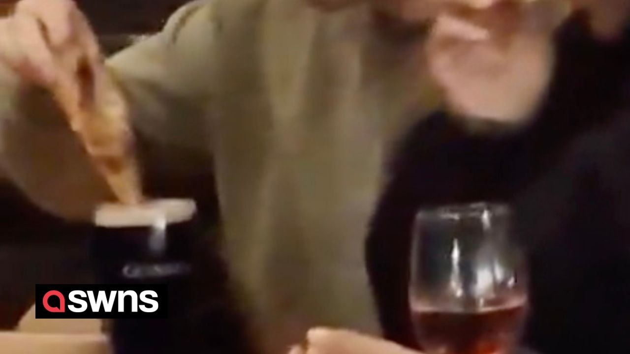 Woman captures the 'horrifying' moment a man dips his Domino's pizza into a pint of Guinness