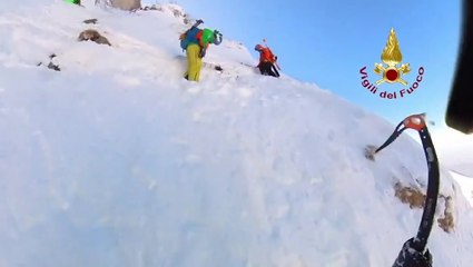 Rescuers battle treacherous snow and ice to save three explorers trapped on Italian mountain