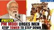 Watch: PM Modi urges people to get off a tower during Andhra Pradesh rally | Oneindia News
