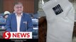 Probe of socks issue will go on despite store's apology, Dewan Rakyat told