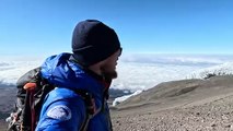 Adventurer Oli France at the summit of Mount Kilimanjaro