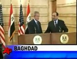 Angry Iraqi throws shoes at Bush in Baghdad