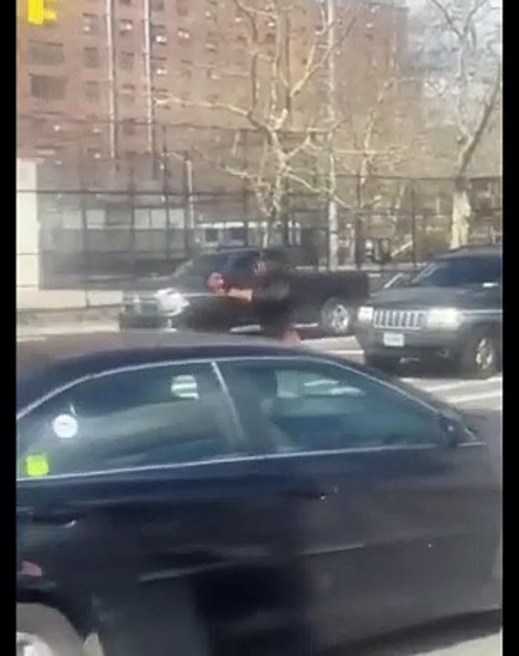 Migrant tries to snatch a woman's purse while riding by her on moped