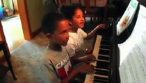 Ana Marquez Greene and her brother Isaiah perform students from Newtown Conn