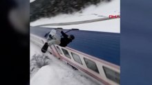 Snowboardla Doğu Ekspresi'nin üzerinden atladı