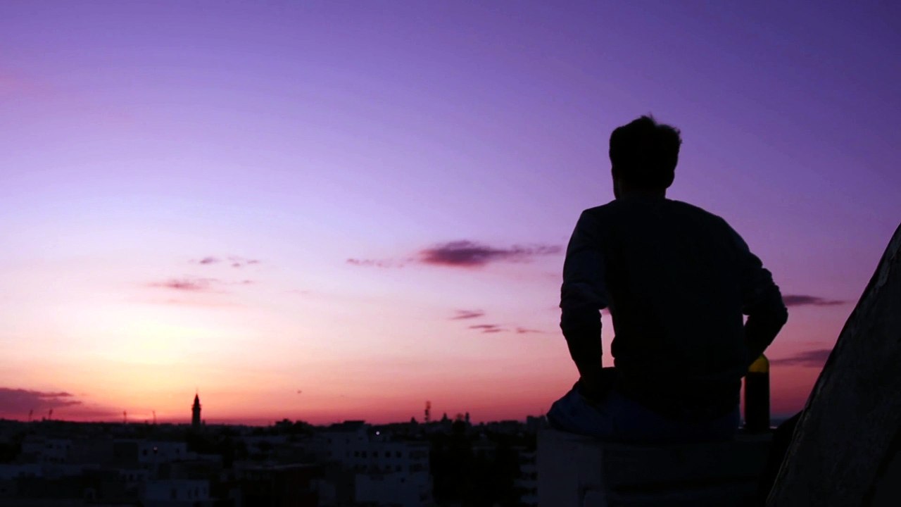 Man Sitting on the Roof