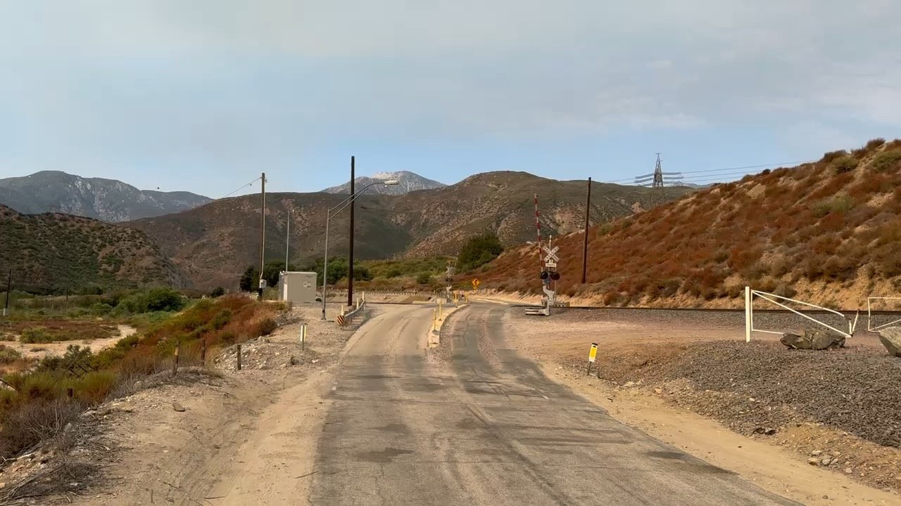 BNSF 7666 Eastbound Manifest Meets BNSF 5479 Westbound Autorack Train Passing Through Blue CA