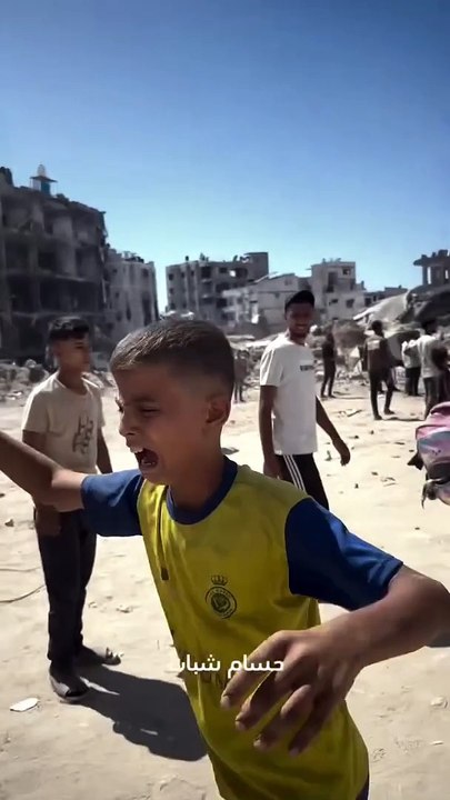 Do the world leaders see and hear the cries of this Palestinian child whose father is targeted and injured by the Israeli forces in Gaza?????