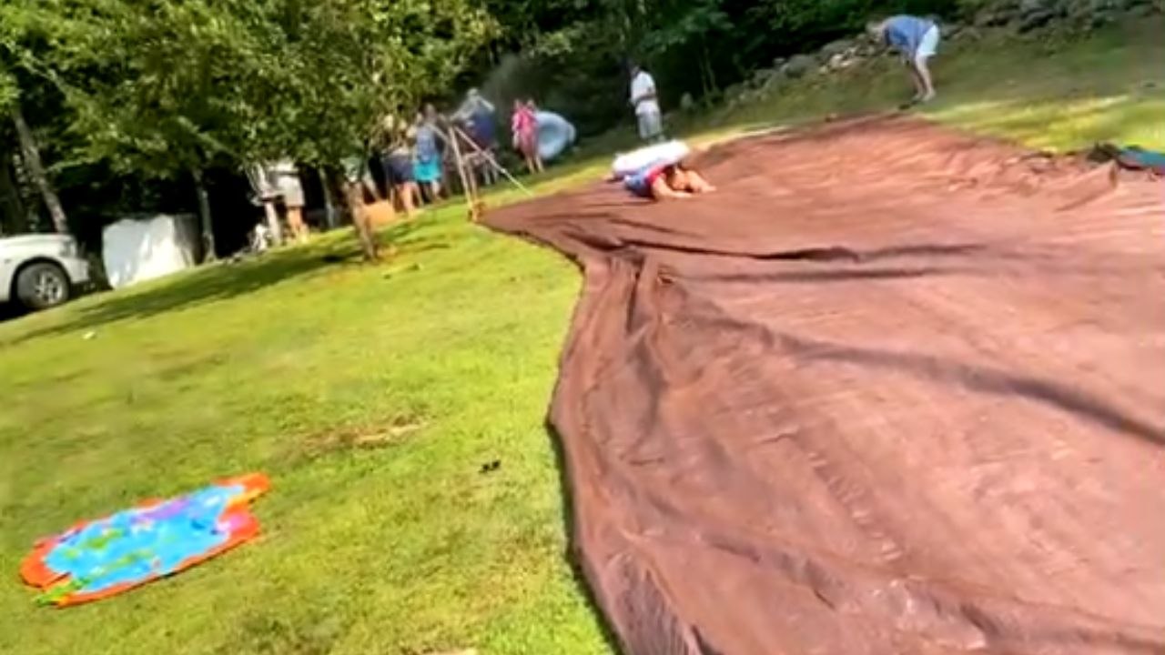 Caring aunt's birthday party slip-and-slide demonstration turns into a hilarious face-plant fail
