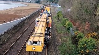 The crane moving onto the site of the train derailment at Grange over Sands