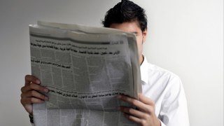 Reading a newspaper is attractive