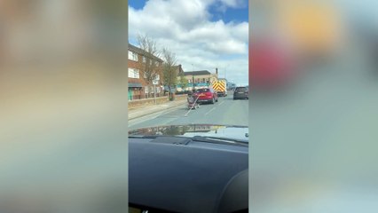 Video shows man towing metal fence from mobility scooter