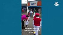 Al ritmo de “La boda del huitlacoche”, niña de la escolta baila en plena ceremonia