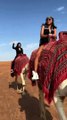 Camel riding on the sand of Abu Dubai Desert