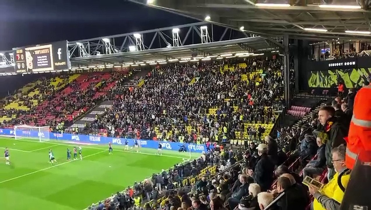 Leeds players warm up in front of the travelling fans at Watford