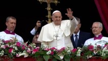 Pope Francis waves from balcony after leading Easter Mass at Vatican