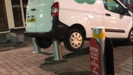 Specsavers van in need of Specsaving after mysteriously getting stuck on bollards