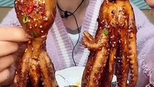 Cute Asian Eating Cooked Octopus