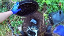 Video shows police officer uncover buried stash of drugs