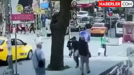 Taksi şoförüyle yaya arasında geçiş hakkı kavgası kamerada