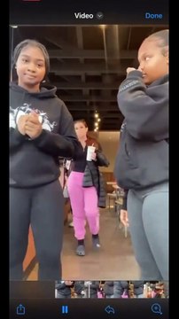 Two young women make it obvious to this woman that they don't like her