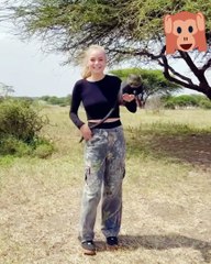 Holding a monkey while dancing