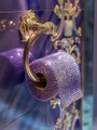 Glamorous luxury toilet paper holder with swarovski crystals in a lilac color,Midjourney prompts