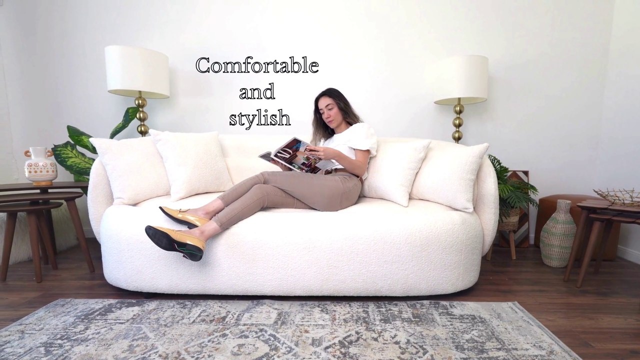 Introducing the epitome of elegance: our Ivory Bouclé Sofa!