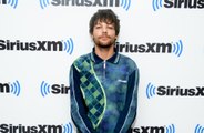 Louis Tomlinson no longer feels like he's in competition with his former One Direction bandmates
